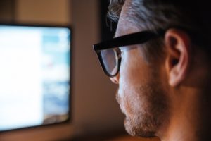 serious man in glasses using computer and looking PTSH2X3 300x200 - Domain, Hosting and Email